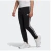 ADIDAS Essentials French Terry Tapered Cuff 3-Stripes Broek -Draag Straal essentials french terry tapered cuff 3 stripes broek