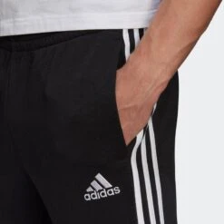 ADIDAS Essentials French Terry Tapered Cuff 3-Stripes Broek -Draag Straal essentials french terry tapered cuff 3 stripes broek 4